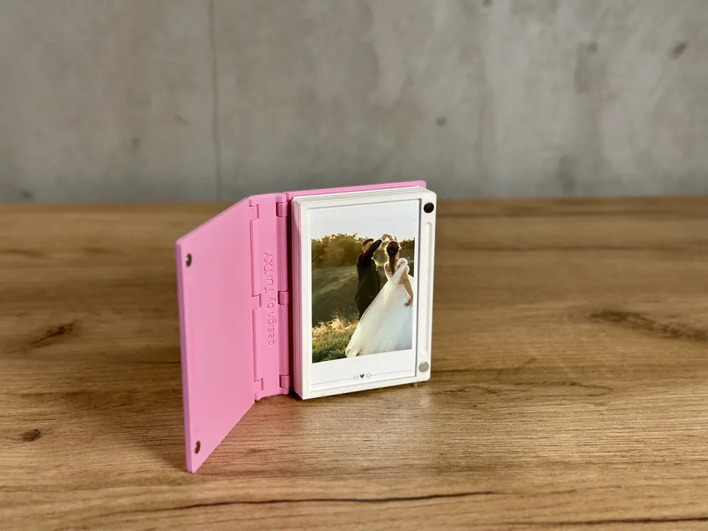 Album standing open on a wooden table